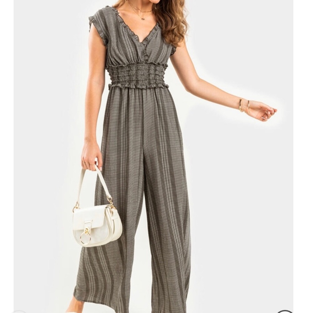 Francesca’s NWT SOMMER STRIPED SMOCKED JUMPSUIT
Never worn!